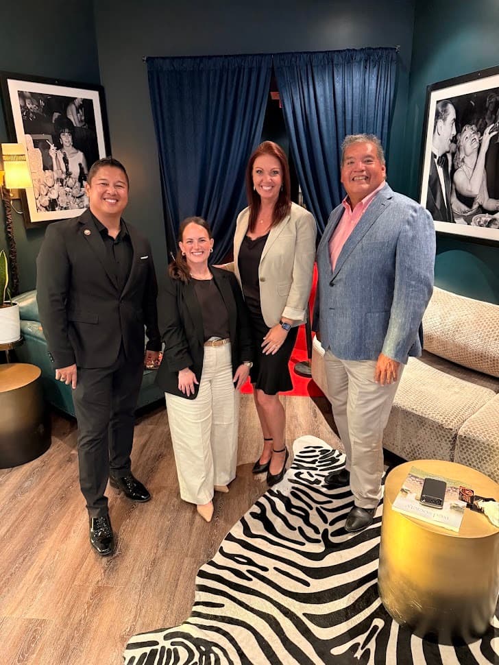 Four Better Together members standing together in a lounge before an Oklahoma City gathering
